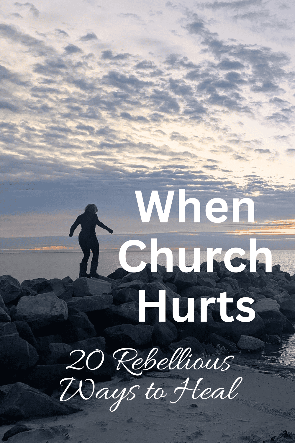 Noel standing on the rocks at the beach as she heals from church betrayal